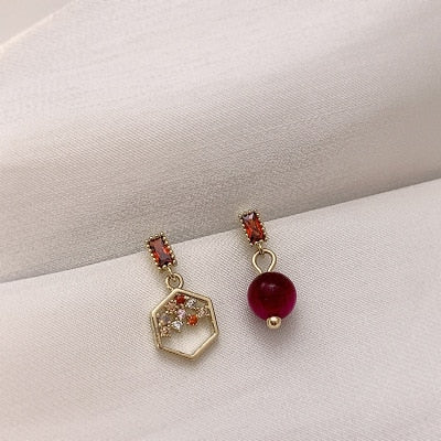 Red pearl and hexagon honeycomb mismatch earrings | Hotel Del Luna | IU